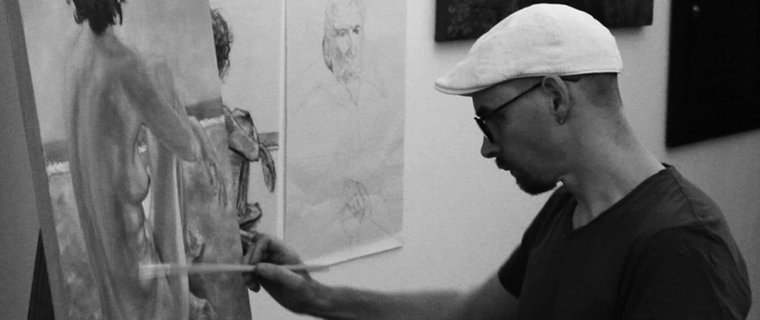 Damian-Osborne-painting-at-easel-black-and-white